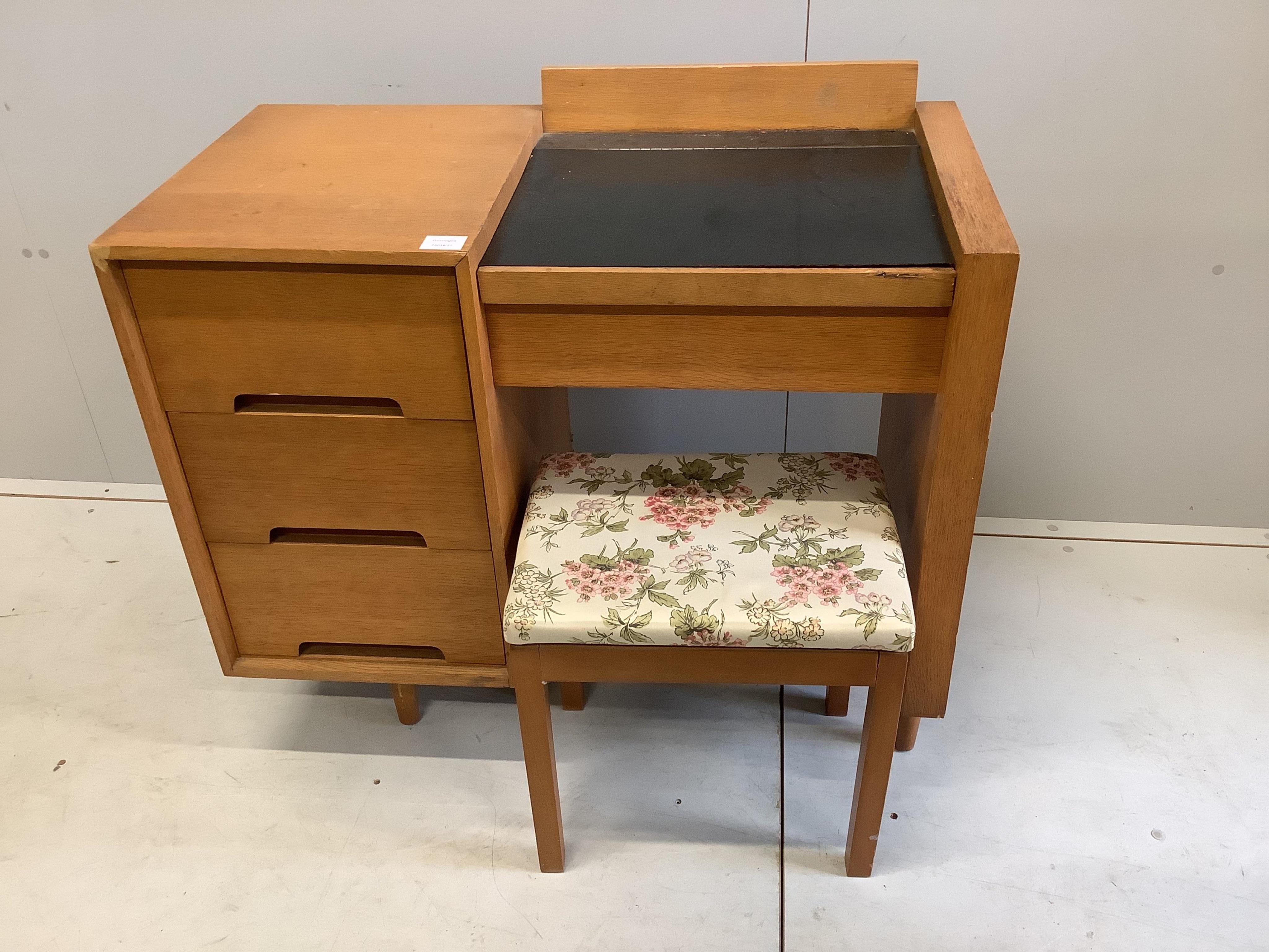 A mid century Stag C-Range oak and beech hinge top dressing table, width 88cm, depth 46cm, height 78cm, and a stool, and a mid century rectangular oak folding tea table, width 90cm, depth 52cm, height 77cm. Condition - f